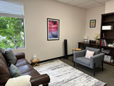 photo glendale office business lounge, light colored circular cubicles,
   burgandy wall covering